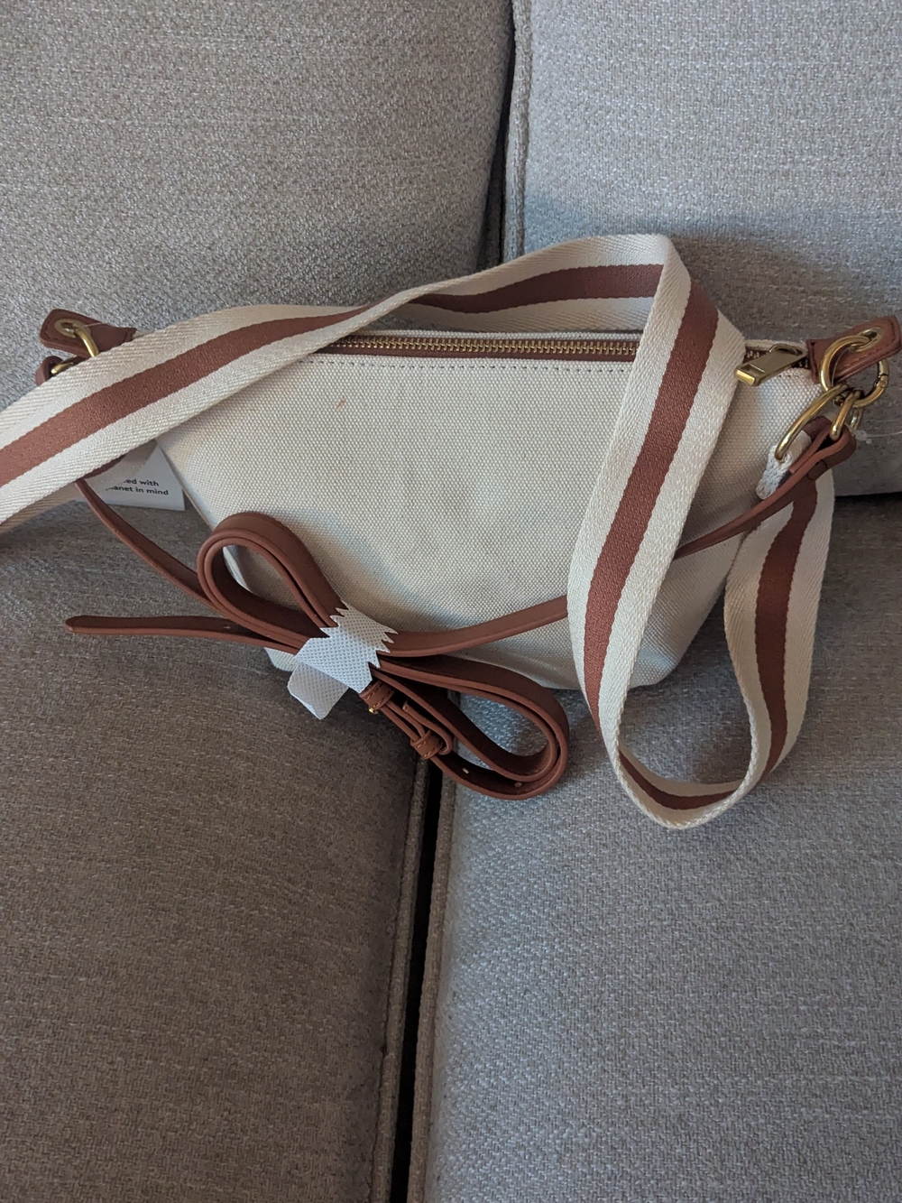 Cream Canvas Crossbody Bag with Brown Trim and Striped Strap